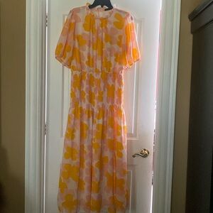 Summer dress size large with pink and orange design. Slit on left side of skirt.